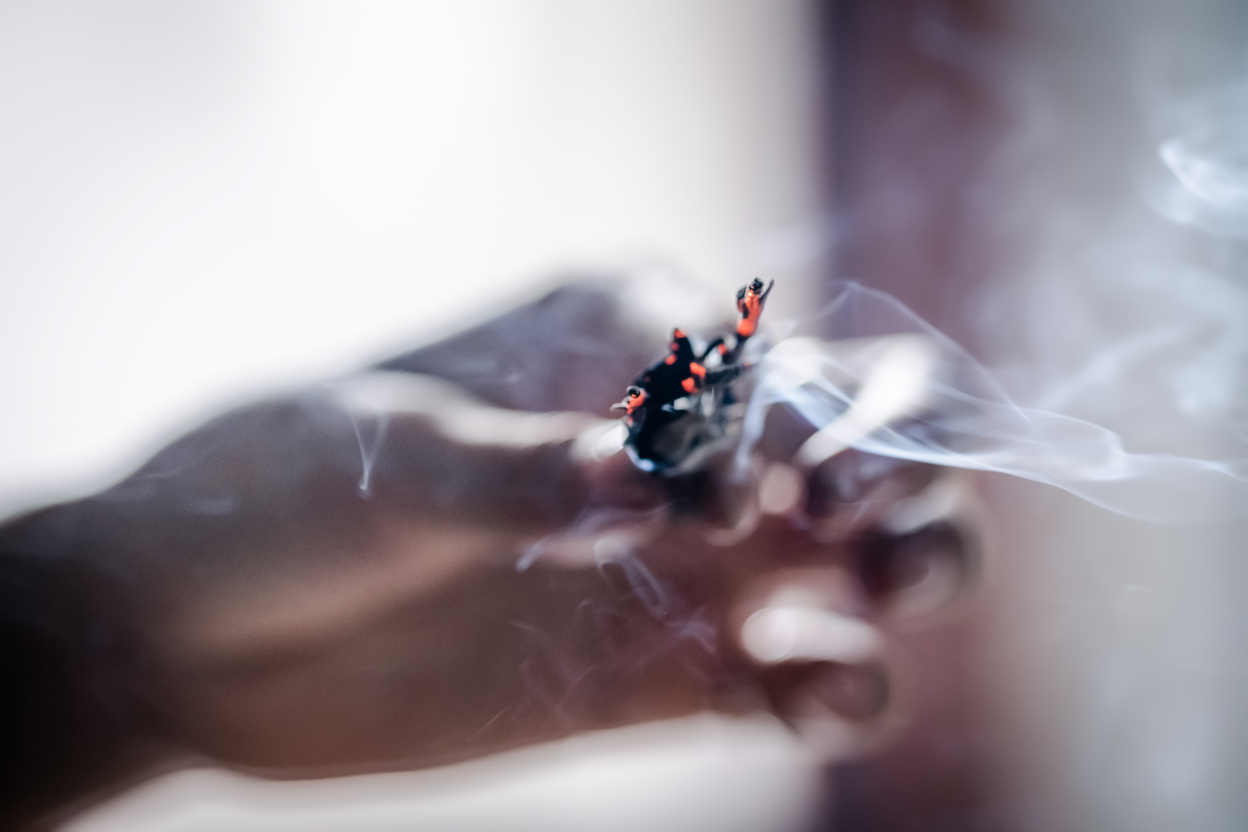 Woman's hands smudging burning sage